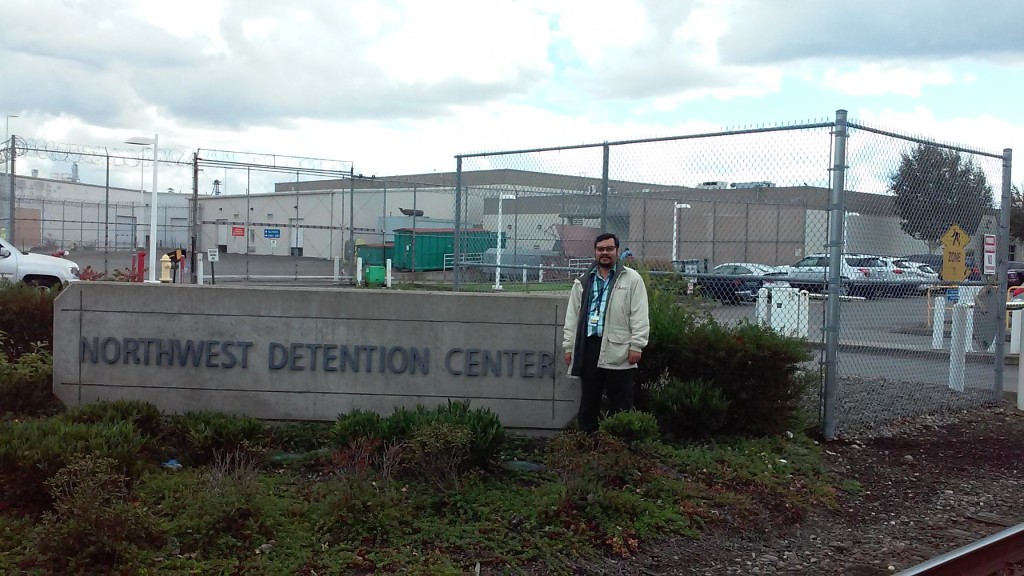 pastor in front of detention center